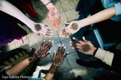 Marvelous shot of Indian bride and bridal party Mehndi art Marvelous shot of Indian bride and bridal party Mehndi art