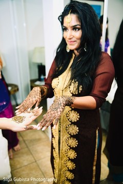 Indian bride showing mehndi art Indian bride showing mehndi art