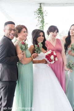 Lovely Indian bride posing with guests. Lovely Indian bride posing with guests.