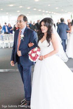 Indian bride walking down the alter with her father Indian bride walking down the alter with her father
