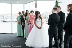 Sweet shot of bride and groom during their vows. Sweet shot of bride and groom during their vows.