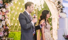 Indian groom giving out speach at reception party. Indian groom giving out speach at reception party.
