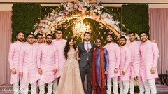 Indian couple possing for a reception photo with groomsmen. Indian couple possing for a reception photo with groomsmen.