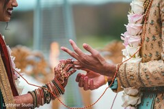 Maharani putting a ring on raja at the wedding ceremony. Maharani putting a ring on raja at the wedding ceremony.