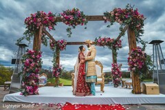 Indian bride and groom posing inside mandap. Indian bride and groom posing inside mandap.