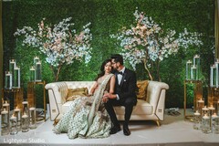 Indiana couple possing at Indian wedding reception sofa stage. Indiana couple possing at Indian wedding reception sofa stage.