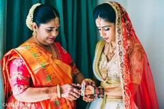 Maharani's mother putting her bangles on. Maharani's mother putting her bangles on.