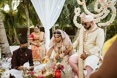 Indian bride pouring offerings to the sacred fire. Indian bride pouring offerings to the sacred fire.