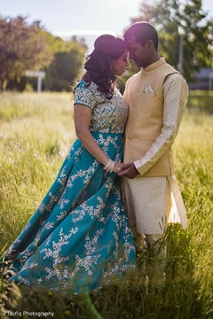 Indian bride and groom possing outdoors. Indian bride and groom possing outdoors.
