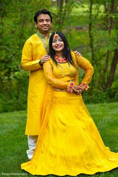 Indian couple on their yellow pre-wedding outfits. Indian couple on their yellow pre-wedding outfits.