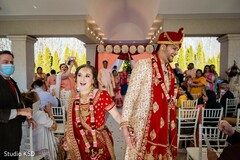 Indian bride and groom walking out of the ceremony. Indian bride and groom walking out of the ceremony.