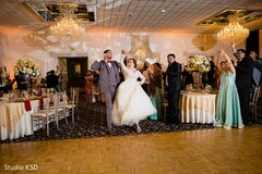 Indian couple walking into wedding reception. Indian couple walking into wedding reception.