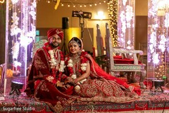 Indian couple wearing their ceremony wedding red outfits. Indian couple wearing their ceremony wedding red outfits.