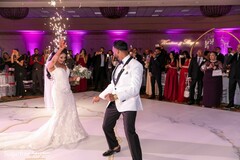 Indian couple dancing at wedding reception stage. Indian couple dancing at wedding reception stage.