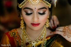 Indian bride with her ceremony jewelry and makeup. Indian bride with her ceremony jewelry and makeup.