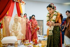 Indian bride making her entrance to the wedding ceremony. Indian bride making her entrance to the wedding ceremony.