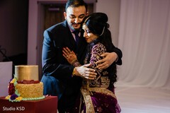 Indian wedding cutting cake moment. Indian wedding cutting cake moment.