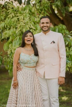 Indian couple posing with their engagement outfits. Indian couple posing with their engagement outfits.