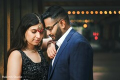 Indian couple posing outdoors for an engagement photo session. Indian couple posing outdoors for an engagement photo session.