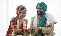 Indian bride putting ring to groom. Indian bride putting ring to groom.