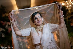 Lovely Indian bride in her bridal lengha. Lovely Indian bride in her bridal lengha.