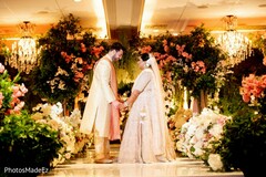 Bride and groom holding hands at the wedding ceremony. Bride and groom holding hands at the wedding ceremony.