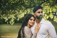 Romantic shot of bride and groom during their engagement photoshoot. Romantic shot of bride and groom during their engagement photoshoot.
