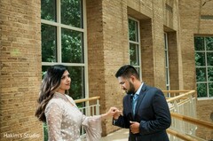 Indian groom exited by looking at bride's wedding ring Indian groom exited by looking at bride's wedding ring