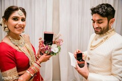 Indian bride and groom exited by showing their wedding rings. Indian bride and groom exited by showing their wedding rings.