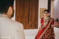 Romantic Indian bride and groom looking at each other. Romantic Indian bride and groom looking at each other.