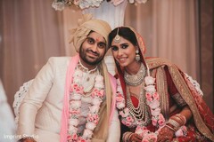 Lovely Indian bride and groom posing together. Lovely Indian bride and groom posing together.