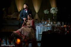 Adorable Indian bride posing and holding hands Adorable Indian bride posing and holding hands