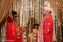 Romantic Indian bride and groom looking at each other. Romantic Indian bride and groom looking at each other.