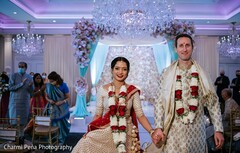 Sweet shot of Indian couple walking holding hands. Sweet shot of Indian couple walking holding hands.