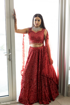 Adorable Indian bride posing in her reception outfit Adorable Indian bride posing in her reception outfit