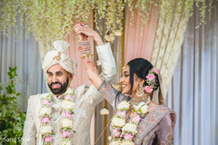 Adorable indian couple posing holding hands Adorable indian couple posing holding hands