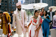 Sweet indian couple leaving wedding ceremony Sweet indian couple leaving wedding ceremony