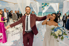Indian newlyweds leaving wedding ceremony Indian newlyweds leaving wedding ceremony