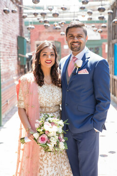 Indian couple glowing in their wedding attire Indian couple glowing in their wedding attire