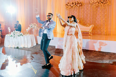 Adorable indian couple dancing during reception Adorable indian couple dancing during reception