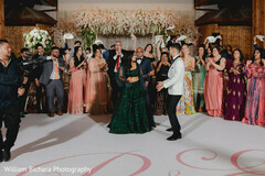Indian couple dancing during reception party Indian couple dancing during reception party