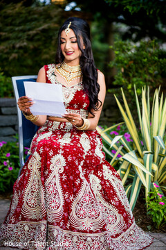 Sweet indian bride reading groom's card Sweet indian bride reading groom's card