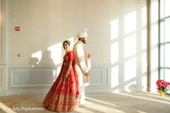 Indian couple holding their back Indian couple holding their back
