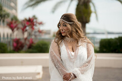 Delicate pearls adorn the bride's elegant white wedding gown Delicate pearls adorn the bride's elegant white wedding gown