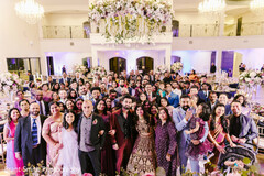 An adorable couple posing with their family filled with love An adorable couple posing with their family filled with love
