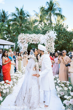 Palm Paradise: A Matrimonial Moment Beneath the Flowers Palm Paradise: A Matrimonial Moment Beneath the Flowers