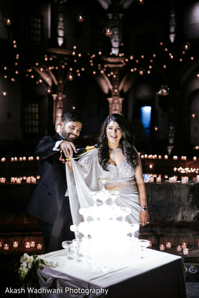 champagne pouring,couple,wedding,champagne tower,celebration,elegant moment,reception,toas