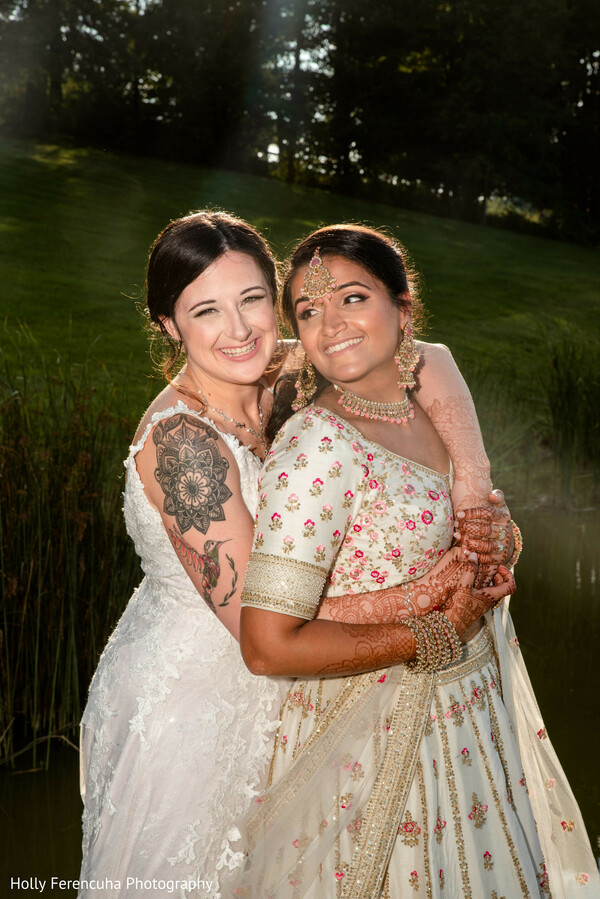 bride and bride,outdoor wedding,joyful smiles,heartfelt embrace,lgbtq+ love,wedding portrait