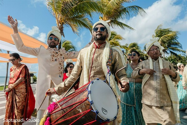 groom’s procession celebration,traditional drum beats,joyful wedding moment,cultural baraat,vibrant groom’s party