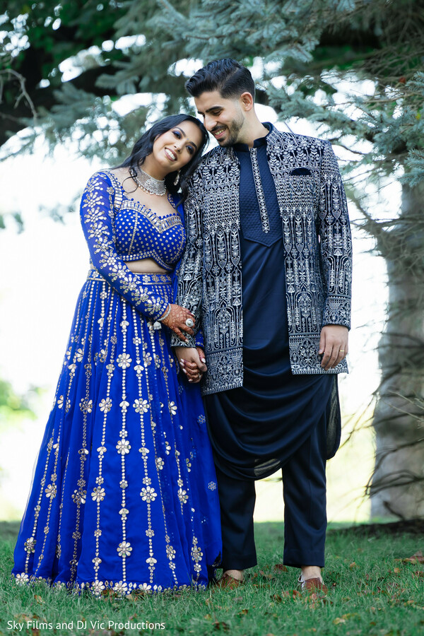 blue and black outfit,wedding photography,elegant couple,pre-wedding shoot,cultural beauty,candid love